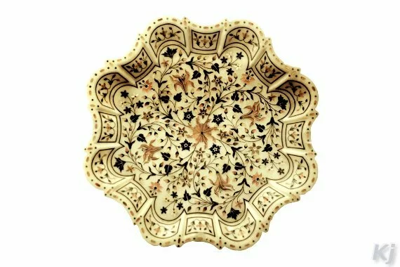 A marble plate inlaid with semi-precious stones